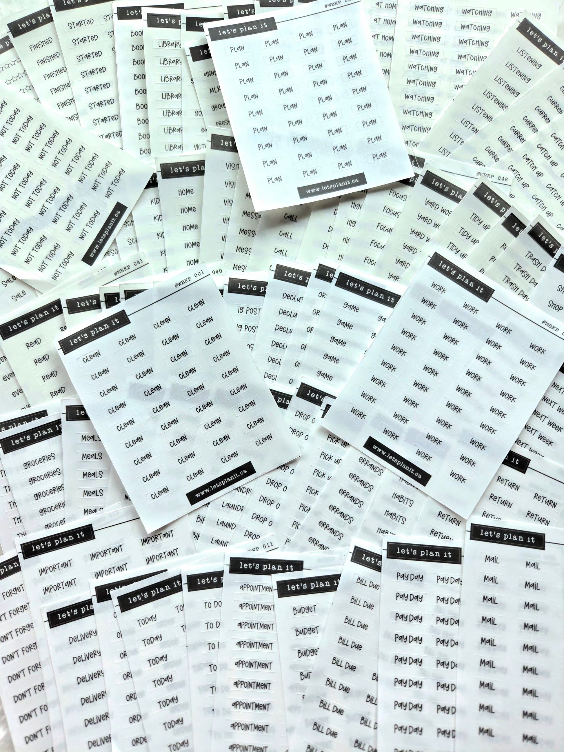 Multiple sheets of planner stickers with text on a white background